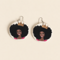 Crowned Afro wooden drop earrings with a painted portrait and metal hooks, shown as a pair.