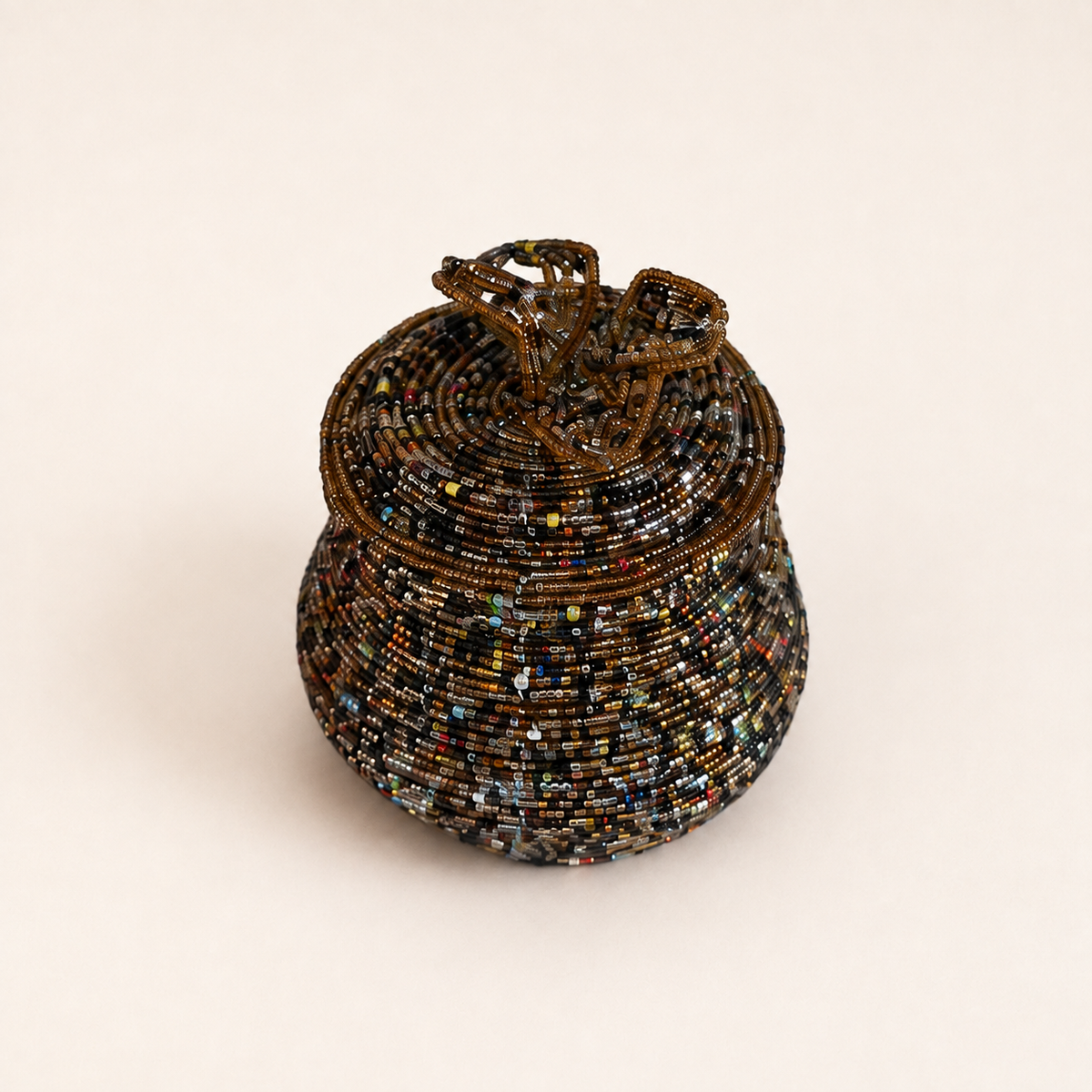 Bronze-coloured hand-beaded jewellery box with multicoloured accents and a floral beaded lid.
