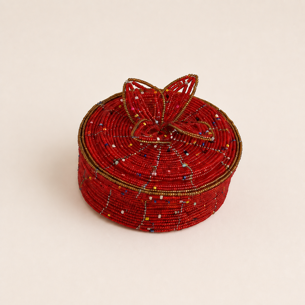 Red hand-beaded jewellery box with gold-coloured trim and raised floral beadwork on the lid.