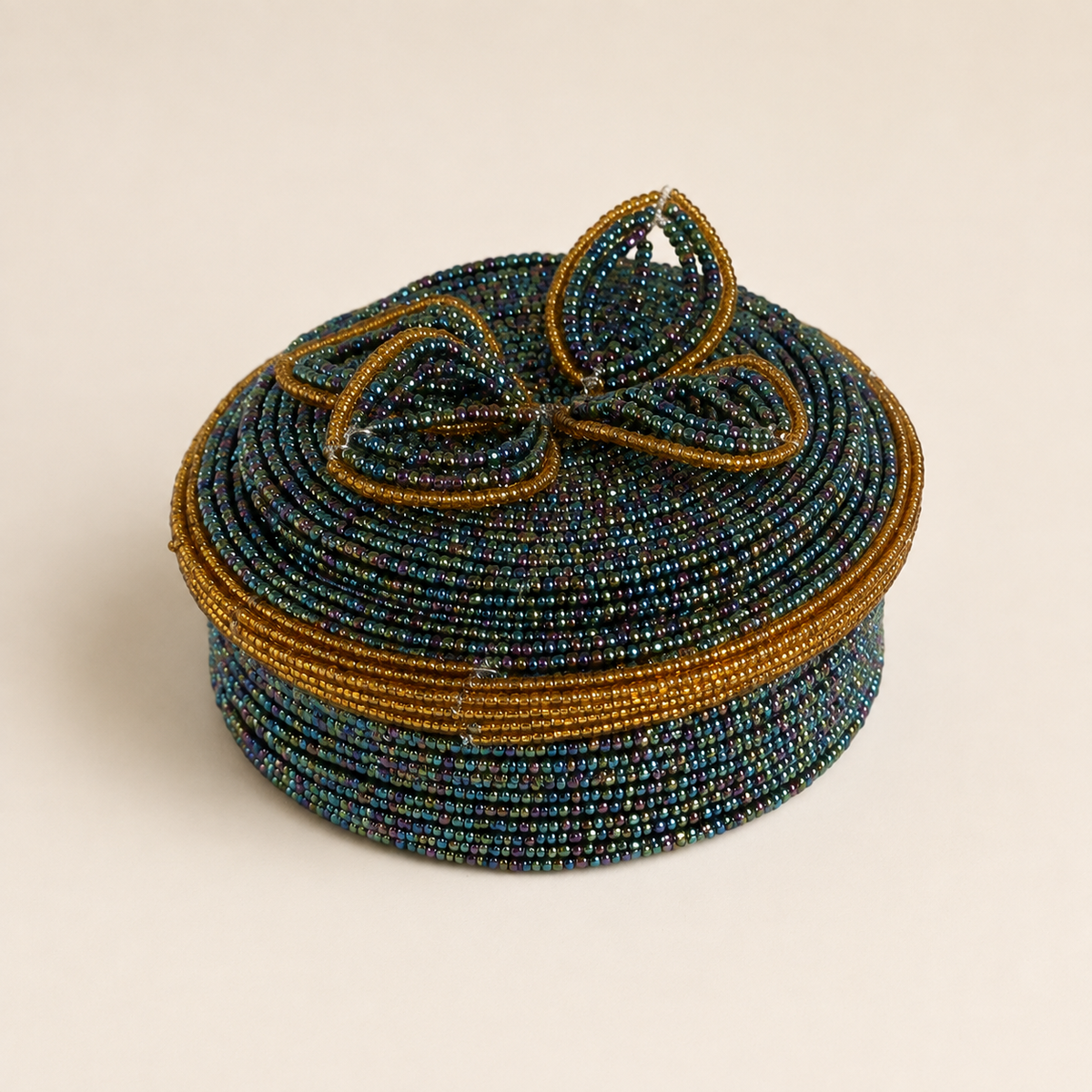 Teal and gold hand-beaded jewellery box with a matching lid and raised floral beadwork.