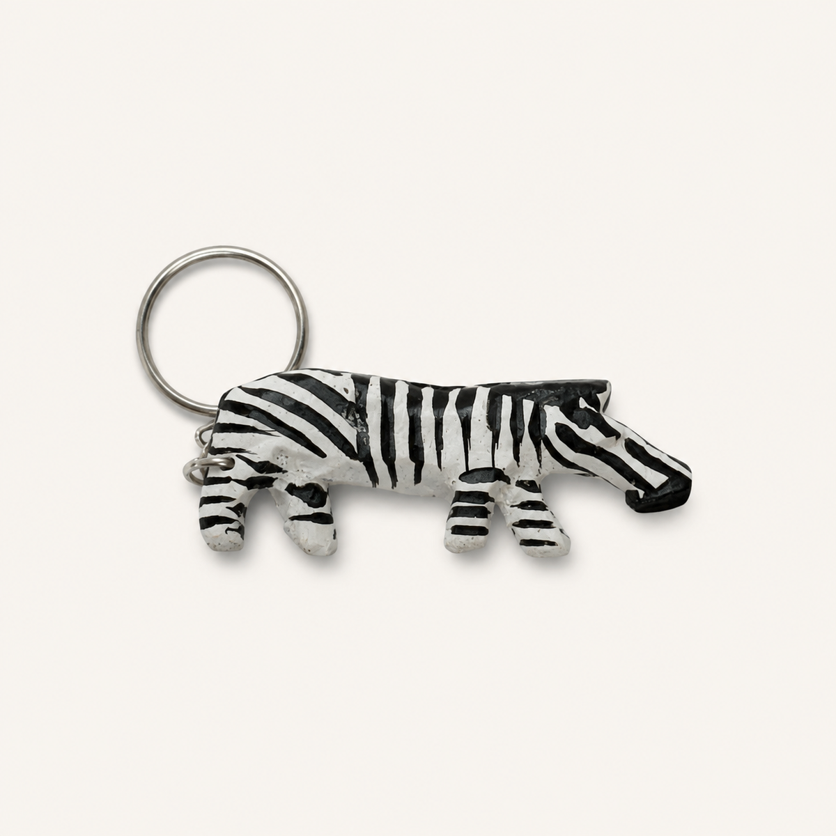 Hand-painted wooden full-body zebra keyring with black-and-white stripes and a metal split ring.