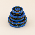 Set of three blue hand-beaded nesting baskets in graduated sizes.